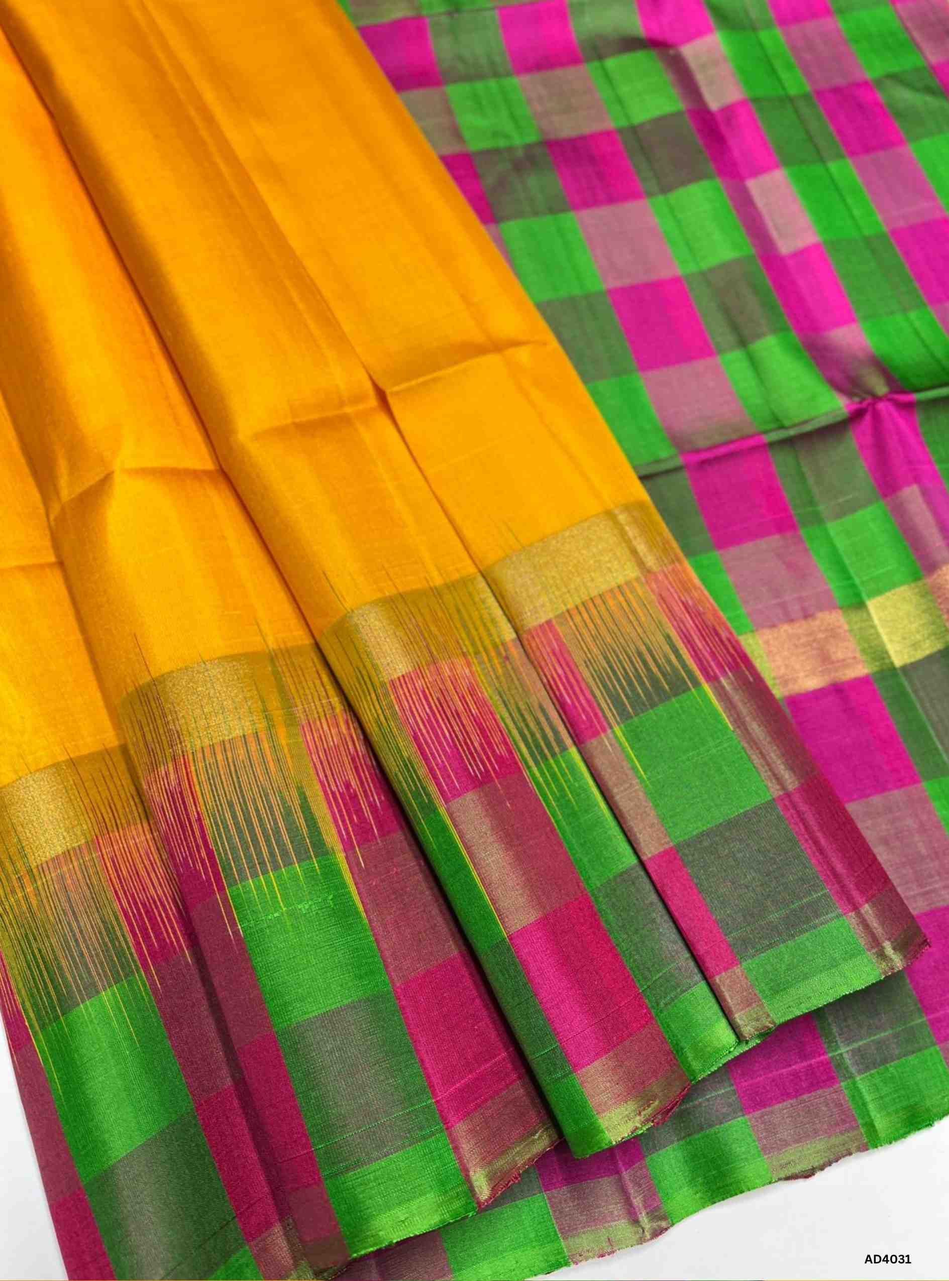 The Yellow, Green & Pink Palum Pazhamum Soft Silk Saree is a joyful handwoven creation inspired by the vibrancy of fruits and festive hues. The radiant yellow symbolizes auspicious brilliance, the refreshing green conveys prosperity and balance, while the lively pink adds feminine charm and celebratory warmth. Together, they form a playful yet regal palette that reflects the essence of South Indian festivities. Enhanced with zari borders and a lustrous drape, this saree is perfect for weddings, temple cerem