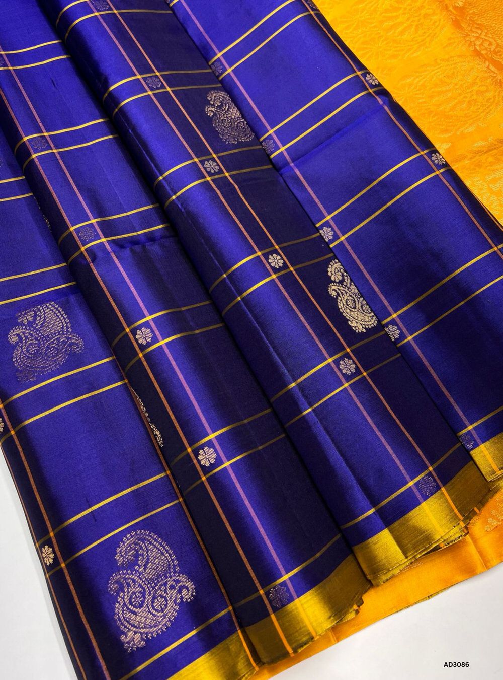 Handwoven Blue body with Yellow pallu Checkered Bhutta Soft Silk Saree featuring gold zari motifs and borders"