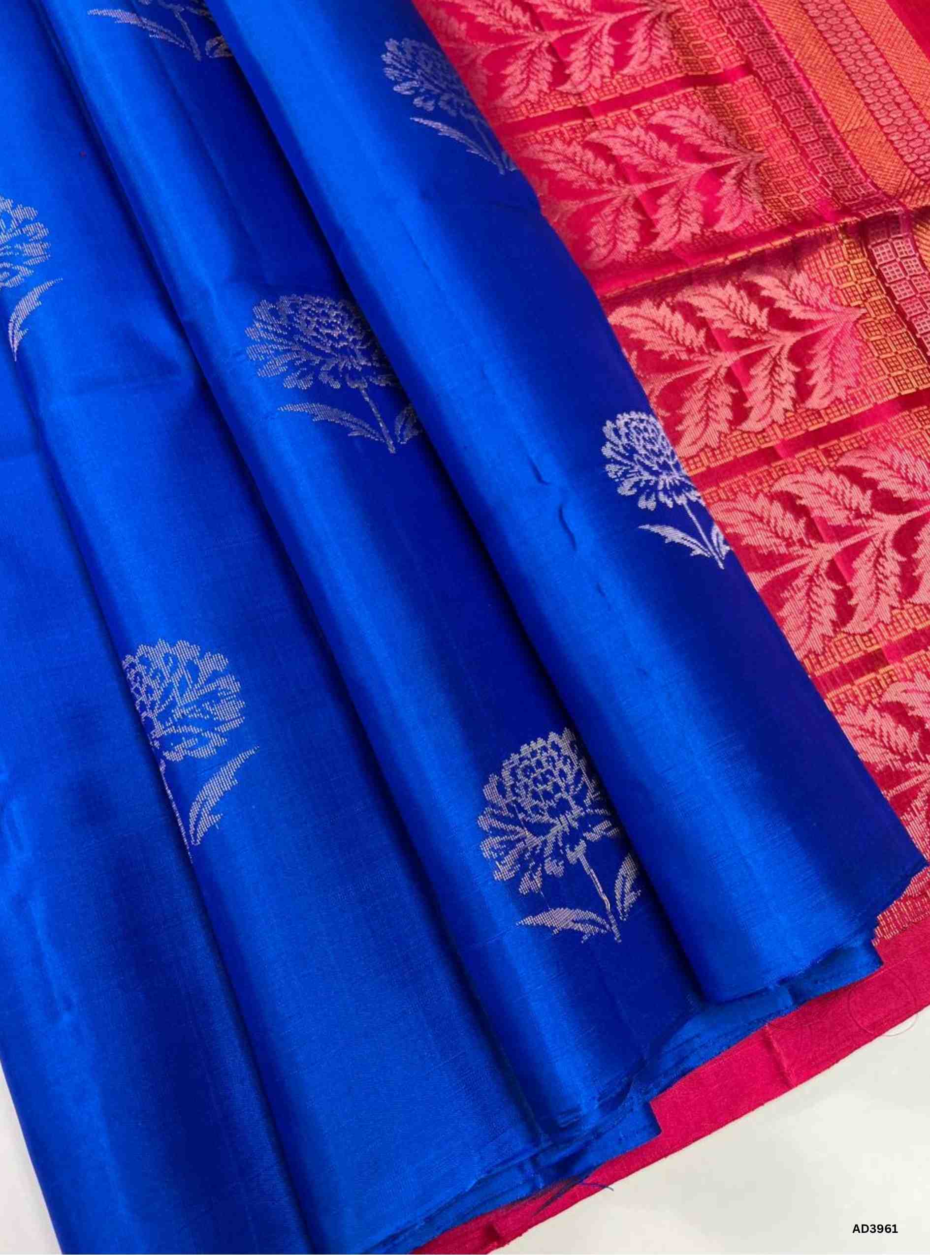 The Copper Sulphate Bhutta Soft Silk Saree is a luminous handwoven creation that radiates festive brilliance and modern charm. The striking copper sulphate blue shade symbolizes vibrancy, freshness, and elegance, while the bhutta weave adds intricate detailing with delicate motifs. Enhanced with zari highlights on the border and pallu, this saree offers a lustrous drape and shimmering appeal, making it perfect for weddings, temple ceremonies, and cultural gatherings. A versatile ensemble, it blends South In