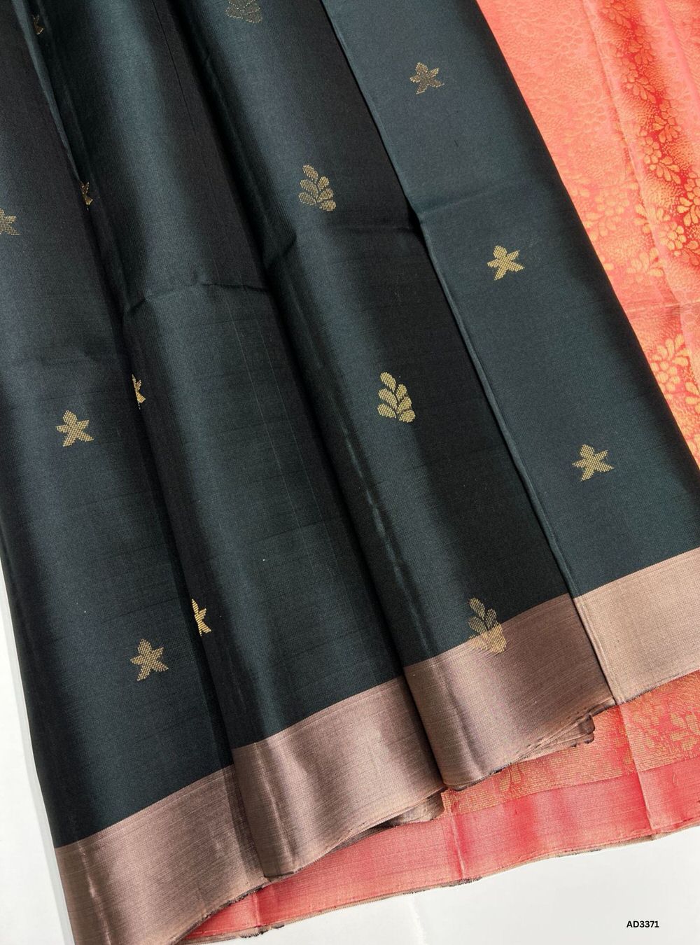 "Handwoven Dark Green body with Peach pallu Bhutta Soft Silk Saree featuring gold zari motifs and borders"