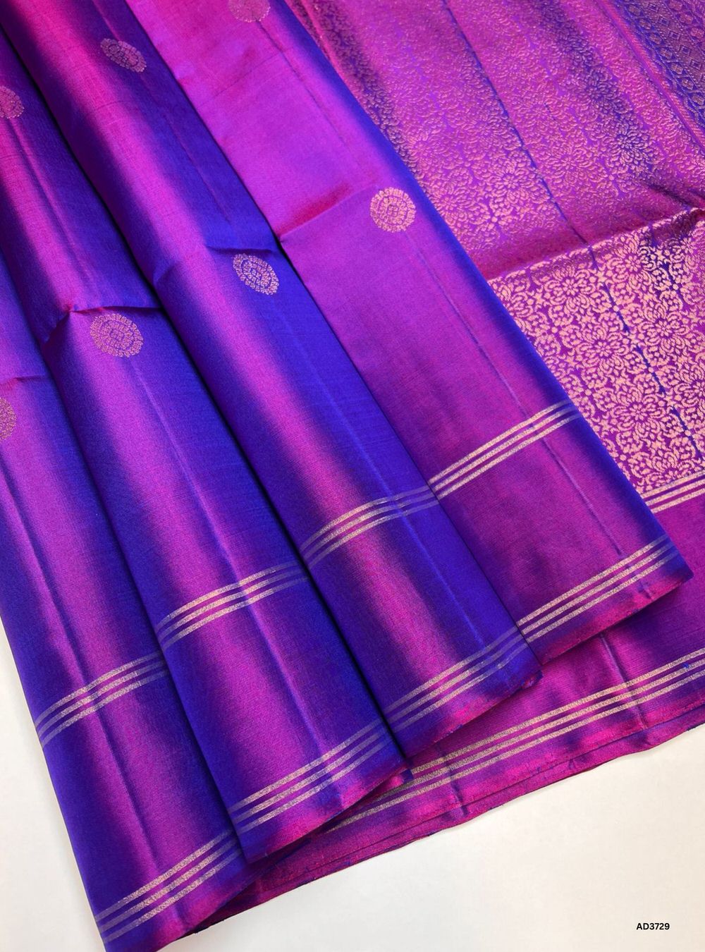 The Dual Tone Purple Soft Silk Saree is a radiant handwoven creation featuring a luminous dual shade of purple enriched with the traditional Bhutta pattern. The intricate zari motifs scattered across the body create a textured elegance, while the dual tone effect adds depth and sophistication. Perfect for weddings, festive occasions, and cultural gatherings, this saree celebrates the heritage of South Indian weaving while offering a refined modern appeal