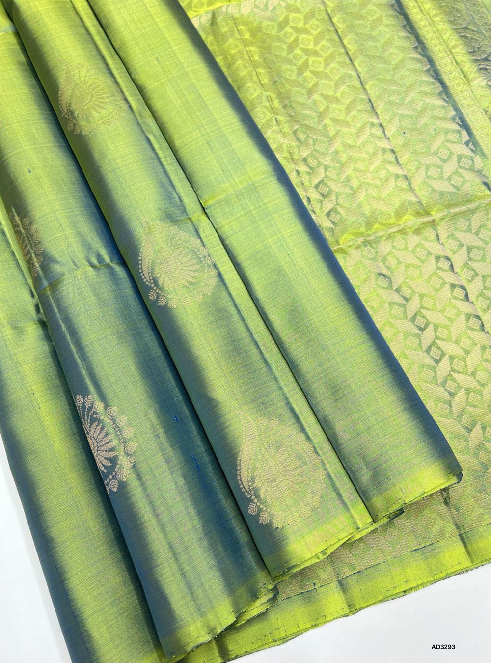 "Handwoven Elaichi Green Bhutta Soft Silk Saree featuring gold zari motifs and borders"