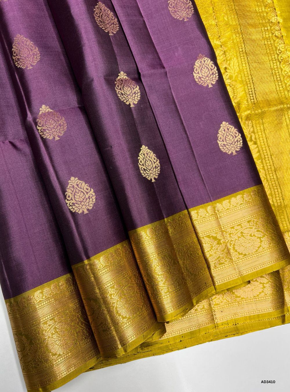 "Handwoven Grape body with Mehendi Green pallu Bhutta Soft Silk Saree featuring gold zari motifs and borders"