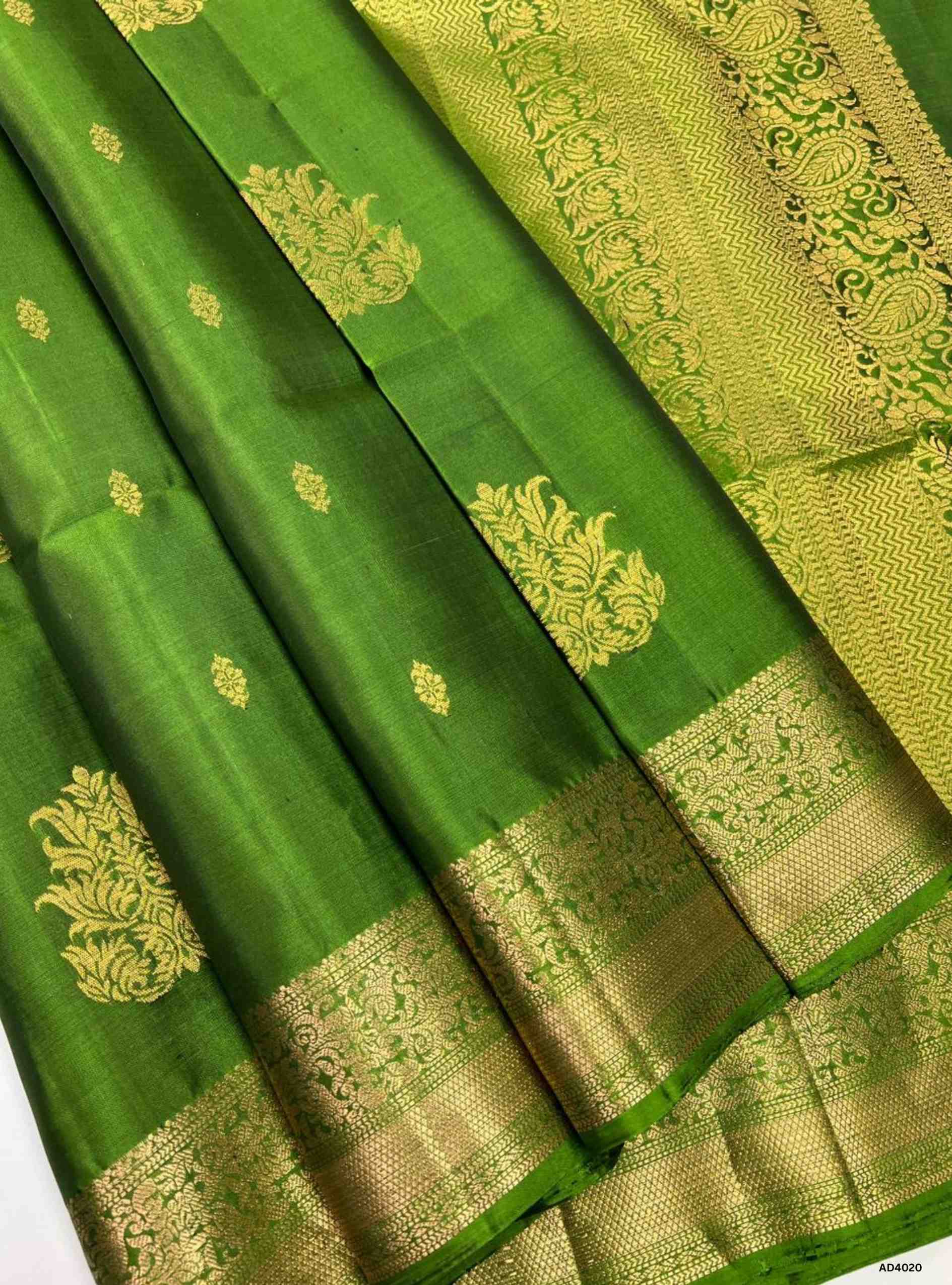 The Green Kanchi Border Soft Silk Saree is a heritage handwoven masterpiece that radiates festive brilliance and cultural richness. The lush green shade symbolizes prosperity, fertility, and auspiciousness, while the grand Kanchi border, adorned with temple‑inspired motifs in pure gold zari, elevates its heritage appeal. The shimmering pallu completes the ensemble, making it perfect for weddings, temple ceremonies, and cultural celebrations. This saree embodies South Indian craftsmanship with a jewel‑tone p