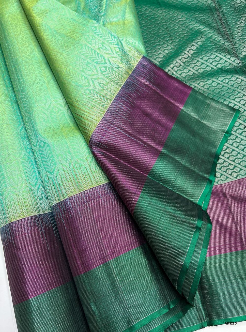 "Handwoven Green body with Plum pallu Full Brocade Soft Silk Saree featuring striped gold zari border"