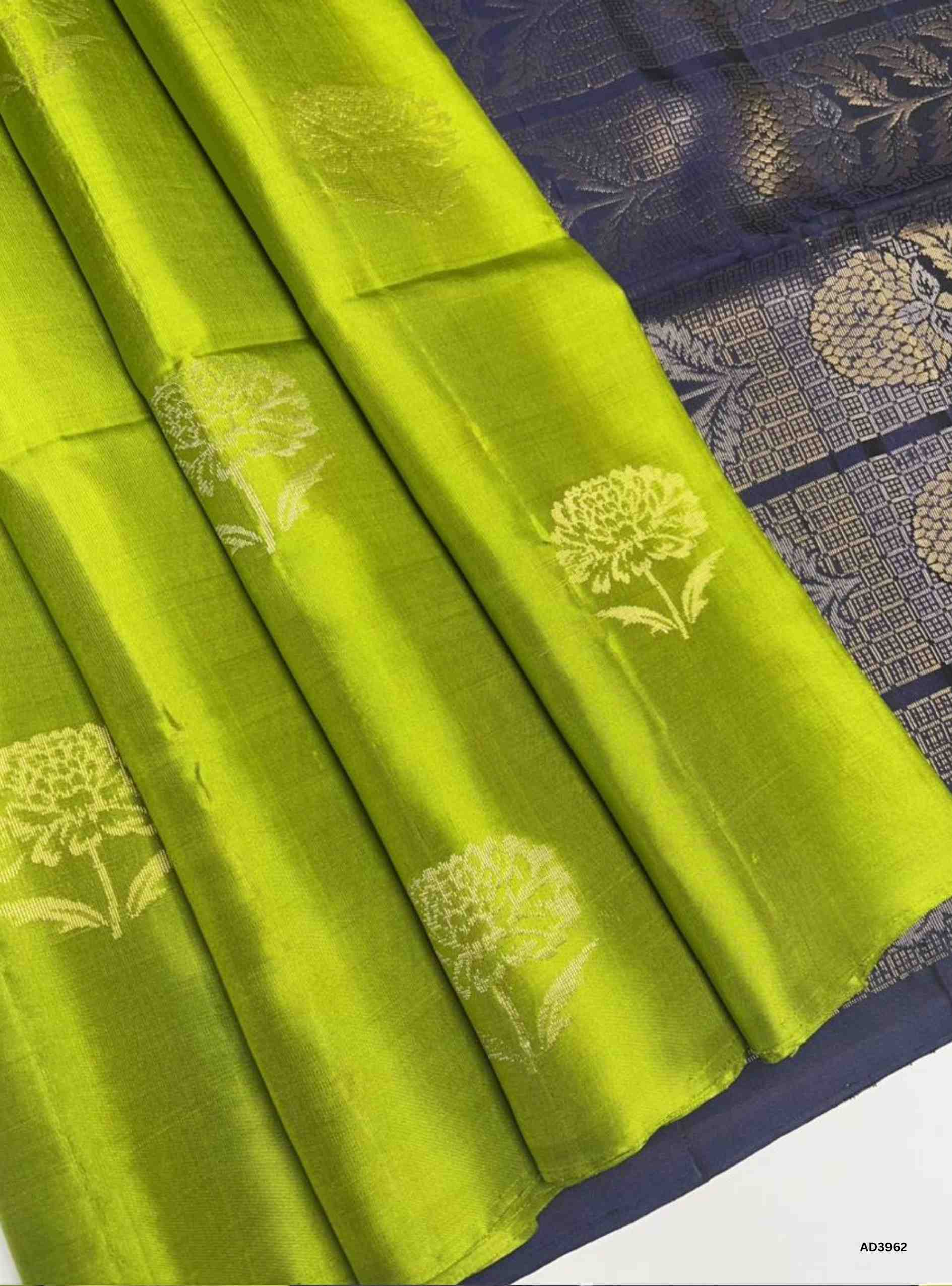 The Light Green & Ink Blue Bhutta Soft Silk Saree is a radiant handwoven creation that celebrates festive elegance in dual tones. The soothing light green shade symbolizes prosperity and freshness, while the deep ink blue adds regal sophistication. The bhutta weave, adorned with intricate motifs, enhances the saree’s artistry, while zari highlights on the border and pallu lend a shimmering appeal. Perfect for weddings, temple ceremonies, and cultural gatherings, this saree embodies South Indian weaving trad