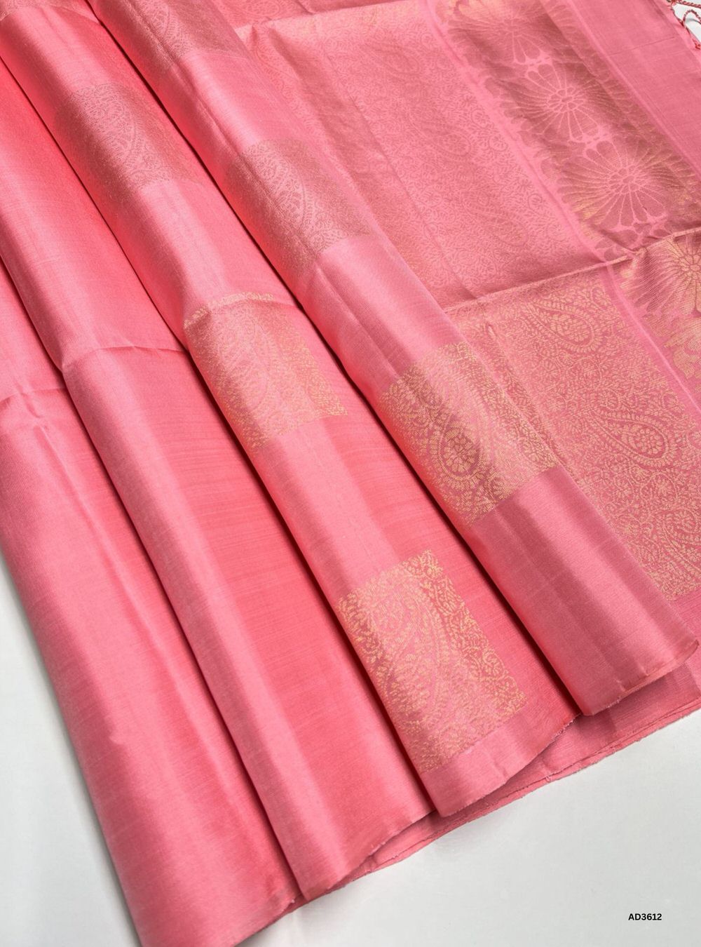 The Light Peach Soft Silk Saree is a graceful handwoven creation featuring a delicate peach body enriched with the traditional Bhutta pattern. The scattered zari motifs add texture and charm, while the soft pastel tone of peach enhances the overall elegance. Perfect for weddings, festive occasions, and cultural gatherings, this saree beautifully blends heritage weaving with modern sophistication.
