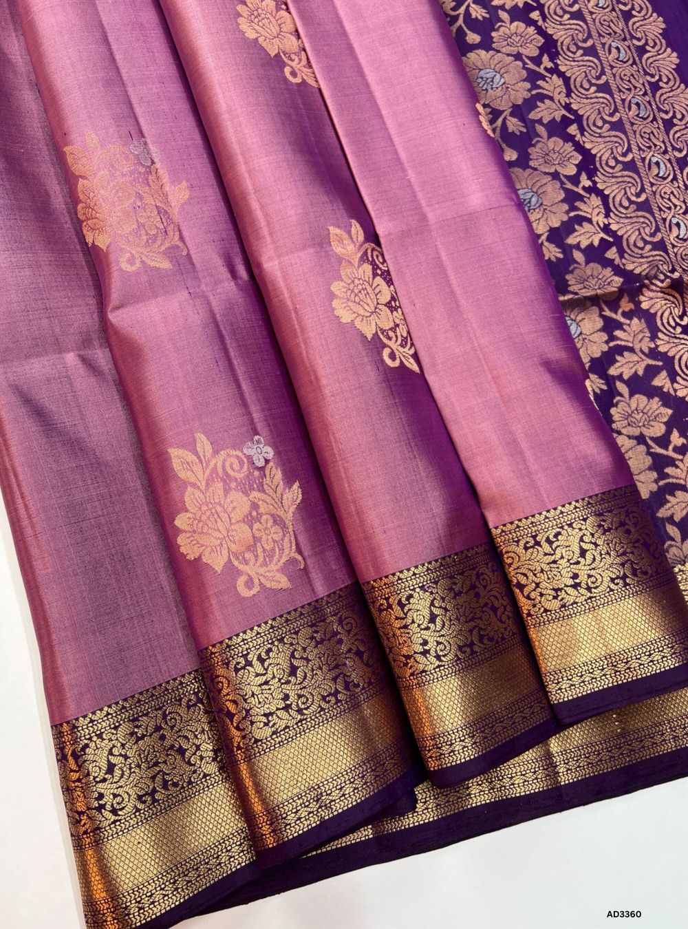"Handwoven Melon Pink body with Wine pallu Bhutta Soft Silk Saree featuring gold zari motifs and borders"