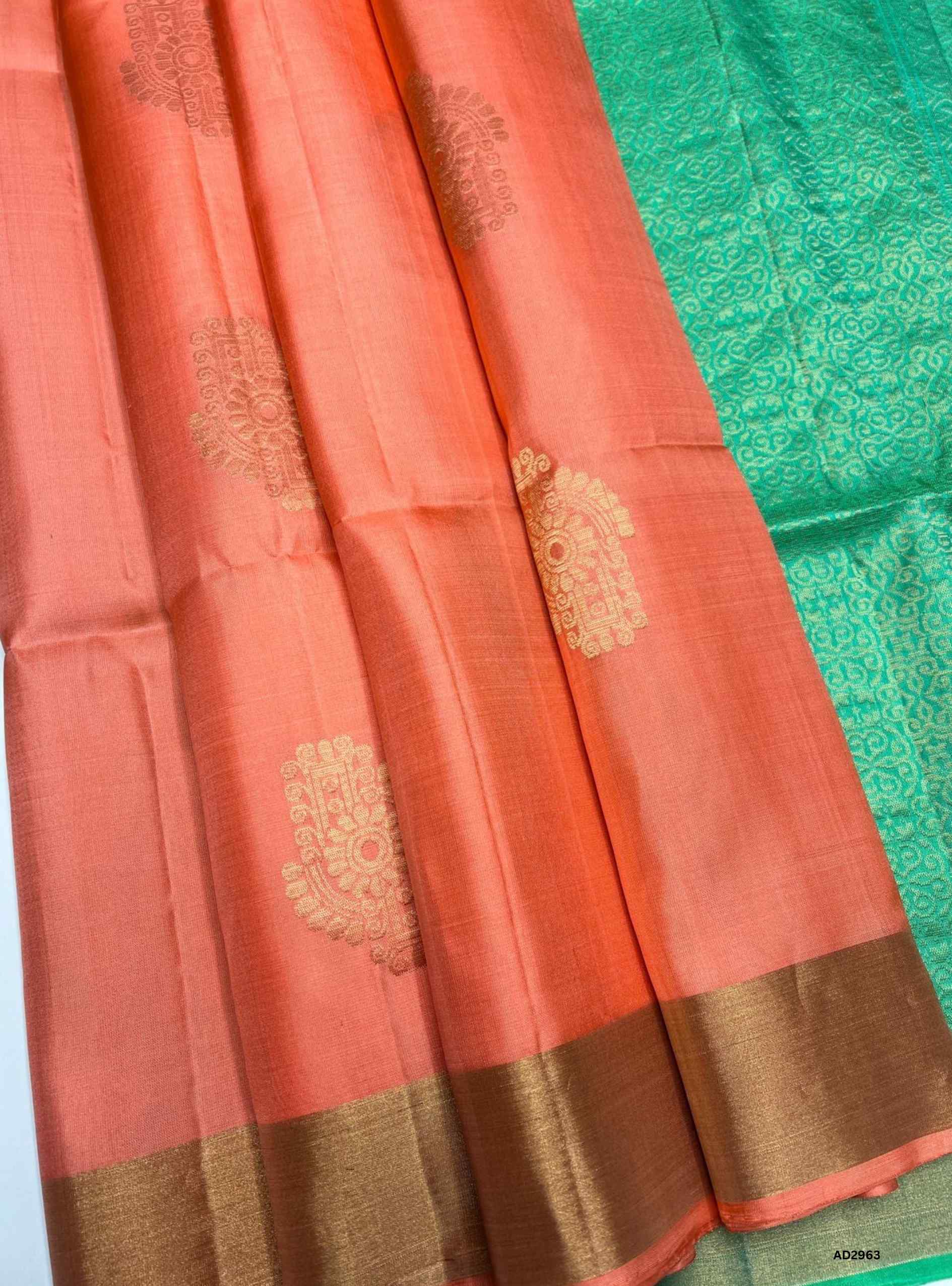 "Handwoven Peach body with Rexona Blue border Bhutta Soft Silk Saree featuring gold zari motifs"