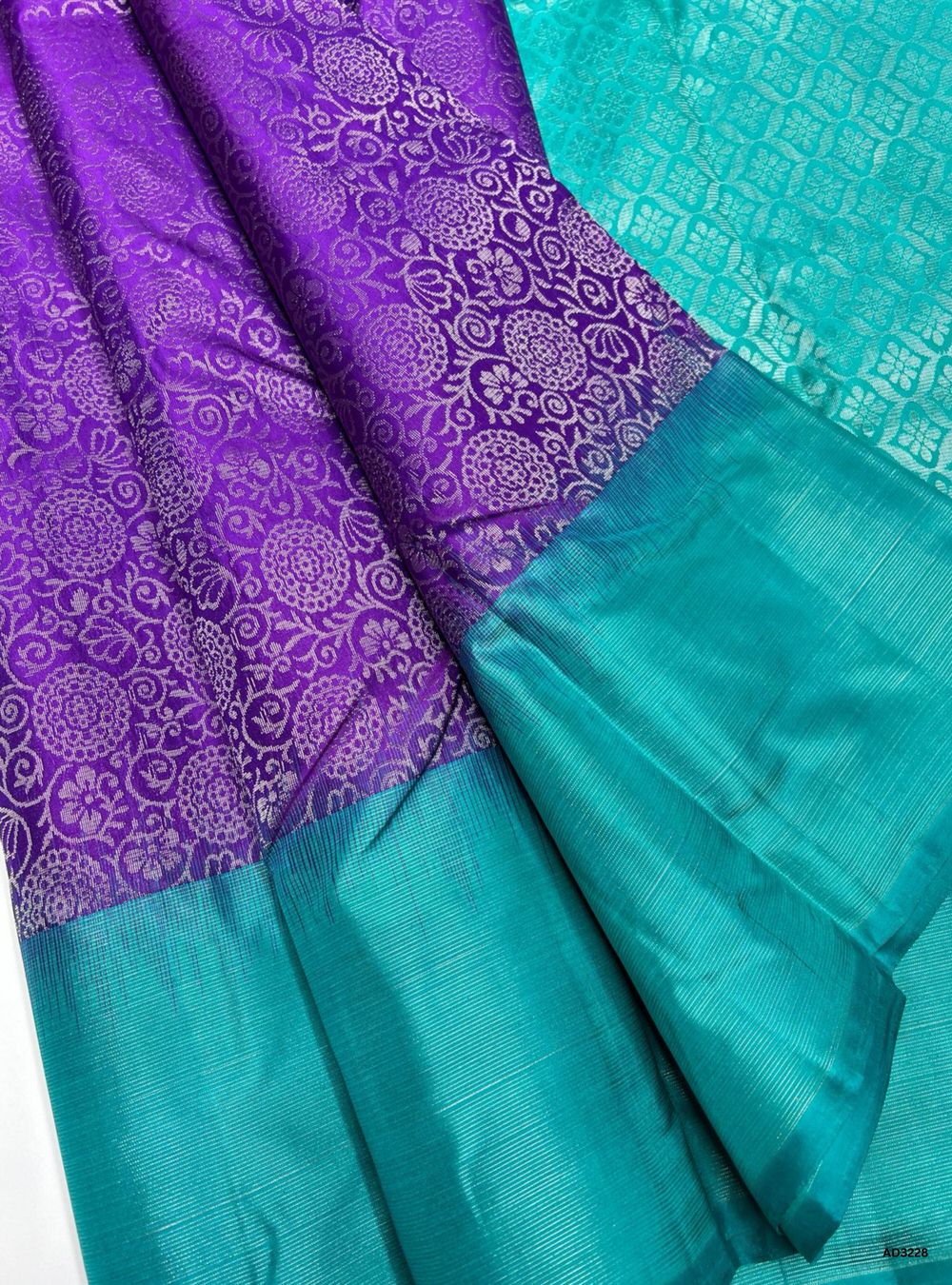 "Handwoven Purple body with Turquoise pallu Full Brocade Soft Silk Saree featuring striped gold zari border"