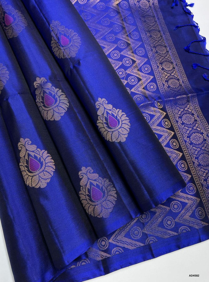 The Royal Blue Bhutta Soft Silk Saree with Pure Gold Zari is a regal handwoven creation that radiates cultural richness and festive brilliance, making it ideal for weddings, temple ceremonies, and traditional celebrations.