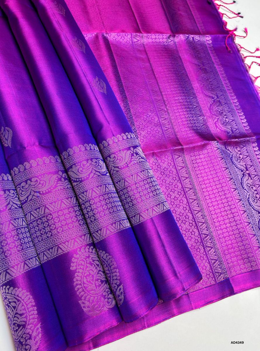 The Royal Purple Fancy Border Soft Silk Saree is a majestic handwoven creation that radiates grandeur and festive charm. The royal purple shade symbolizes devotion, sophistication, and cultural richness, while the fancy border introduces a refreshing modern flourish. Enhanced with pure gold zari and a lustrous drape, this saree is ideal for weddings, temple ceremonies, and cultural celebrations. A timeless masterpiece, it blends jewel‑tone vibrance with contemporary border artistry in South Indian weaving t