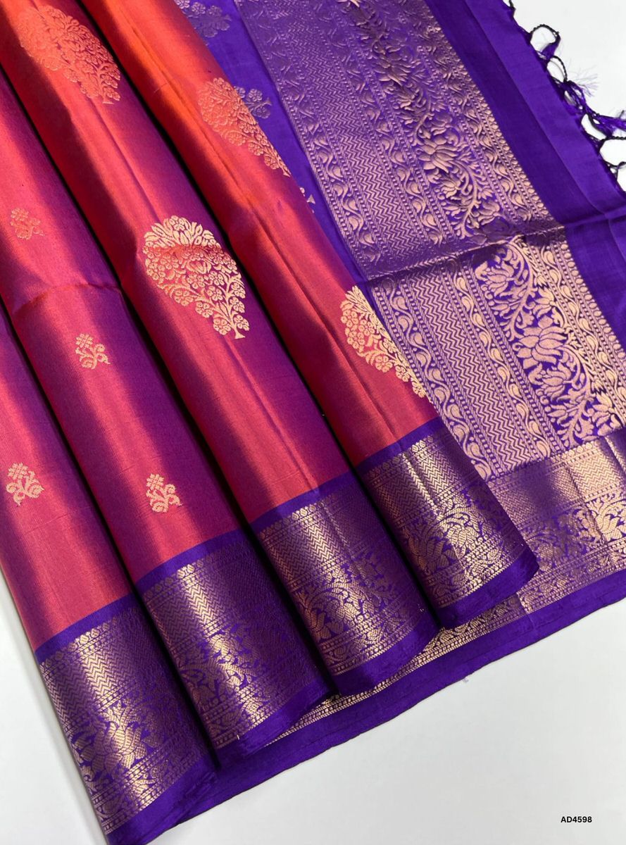 The Rusty Brick Kanchi Border Soft Silk Saree with Pure Gold Zari is a striking handwoven creation that radiates earthy elegance and cultural richness, making it ideal for weddings, festive occasions, and temple ceremonies.