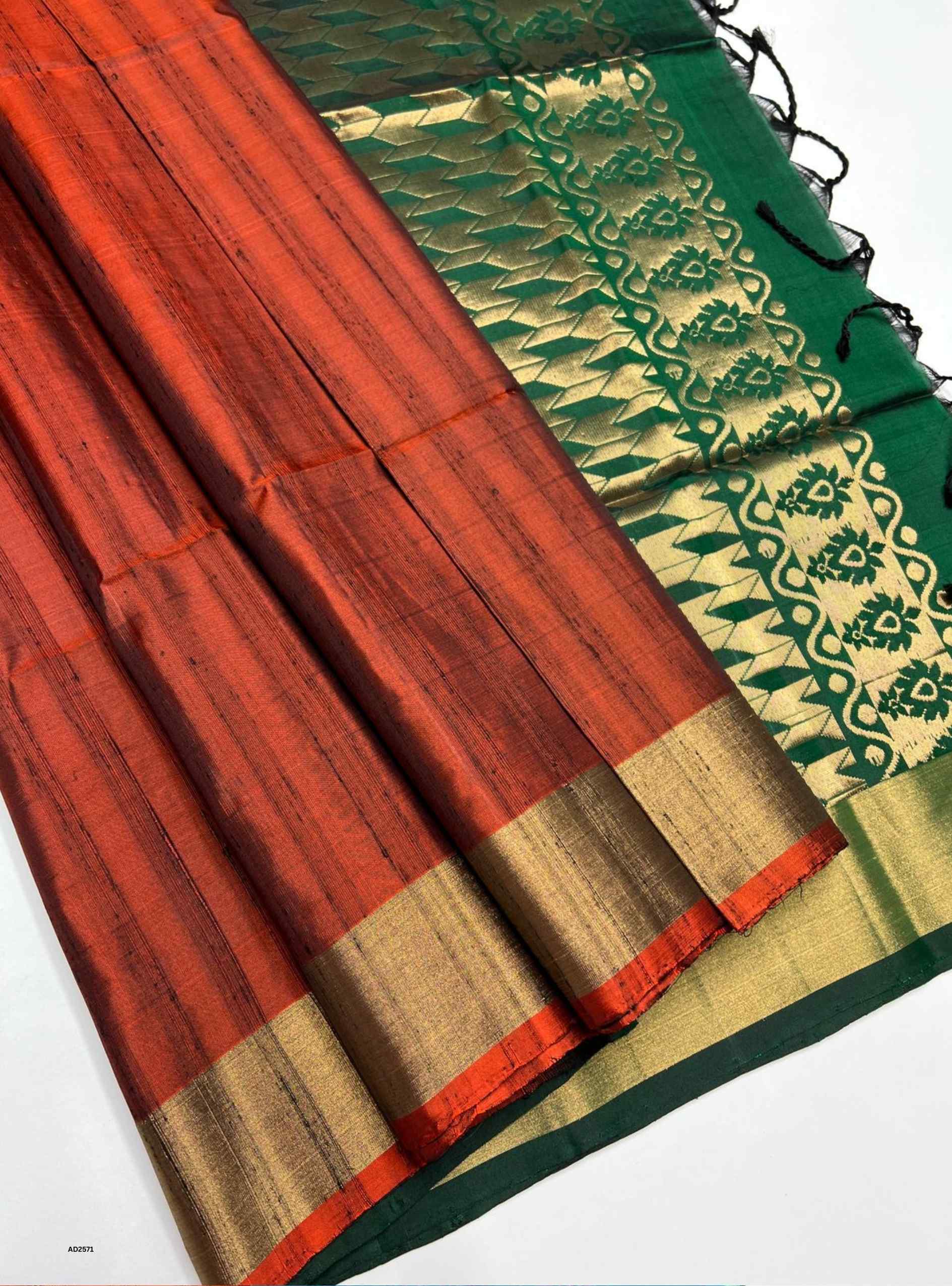 Saree with red, green, and gold patterns