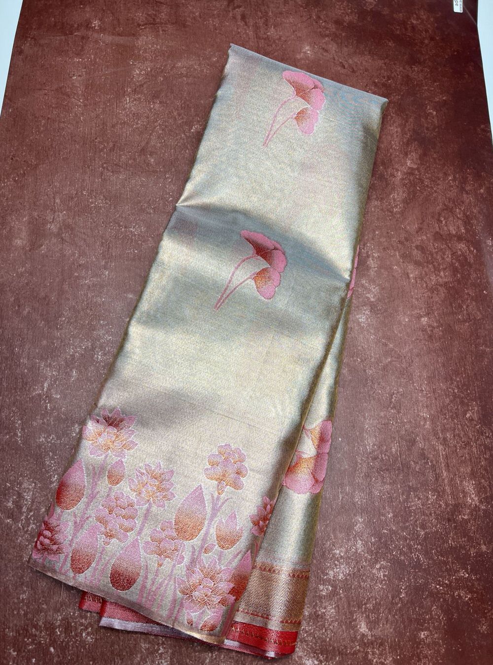 Folded fabric with floral pattern on a textured surface