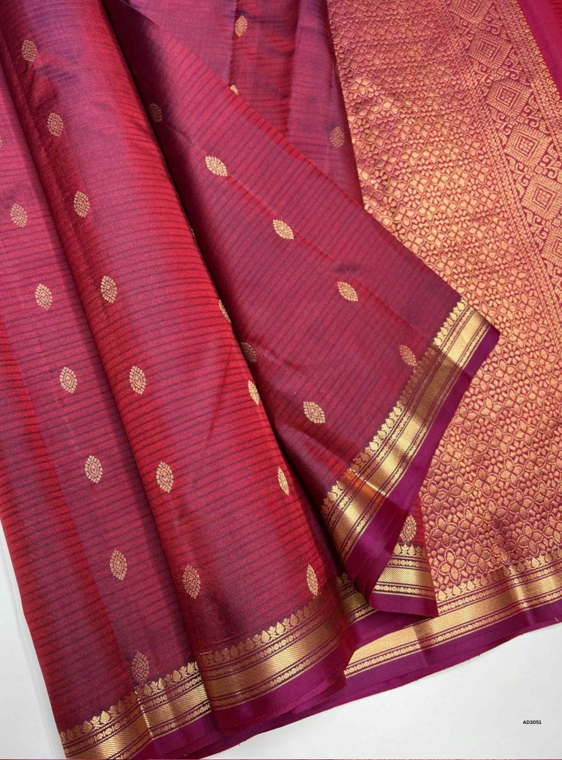 Handwoven Wine body with Jacquard border Bhutta Soft Silk Saree featuring gold zari motifs