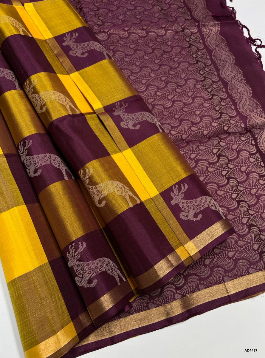 The Wooden Brown & Burgundy Pazhum Pazhamum Soft Silk Saree with Half Fine Tested Gold Zari is a majestic handwoven creation that unites earthy elegance with regal vibrance, making it ideal for weddings, temple ceremonies, and festive occasions.