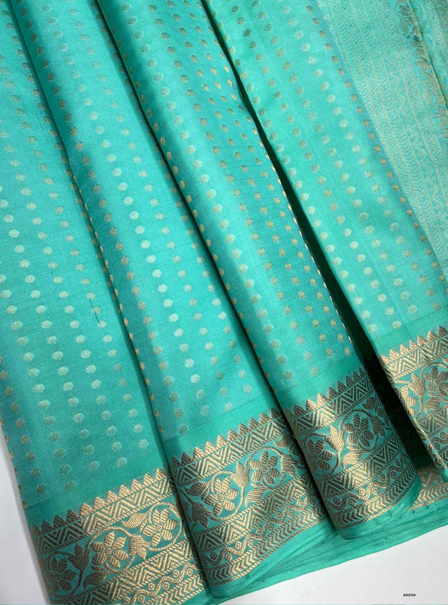 Aqua Jacquard Border Soft Silk Saree with gold zari motifs.