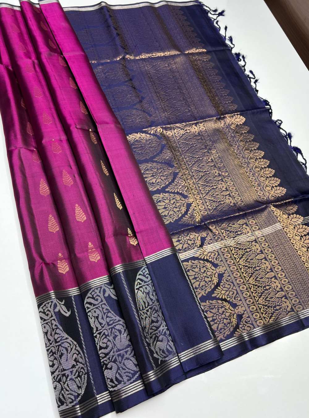 Dark Magenta and Navy Soft Silk Saree with fancy design and gold zari motifs, festive wear.