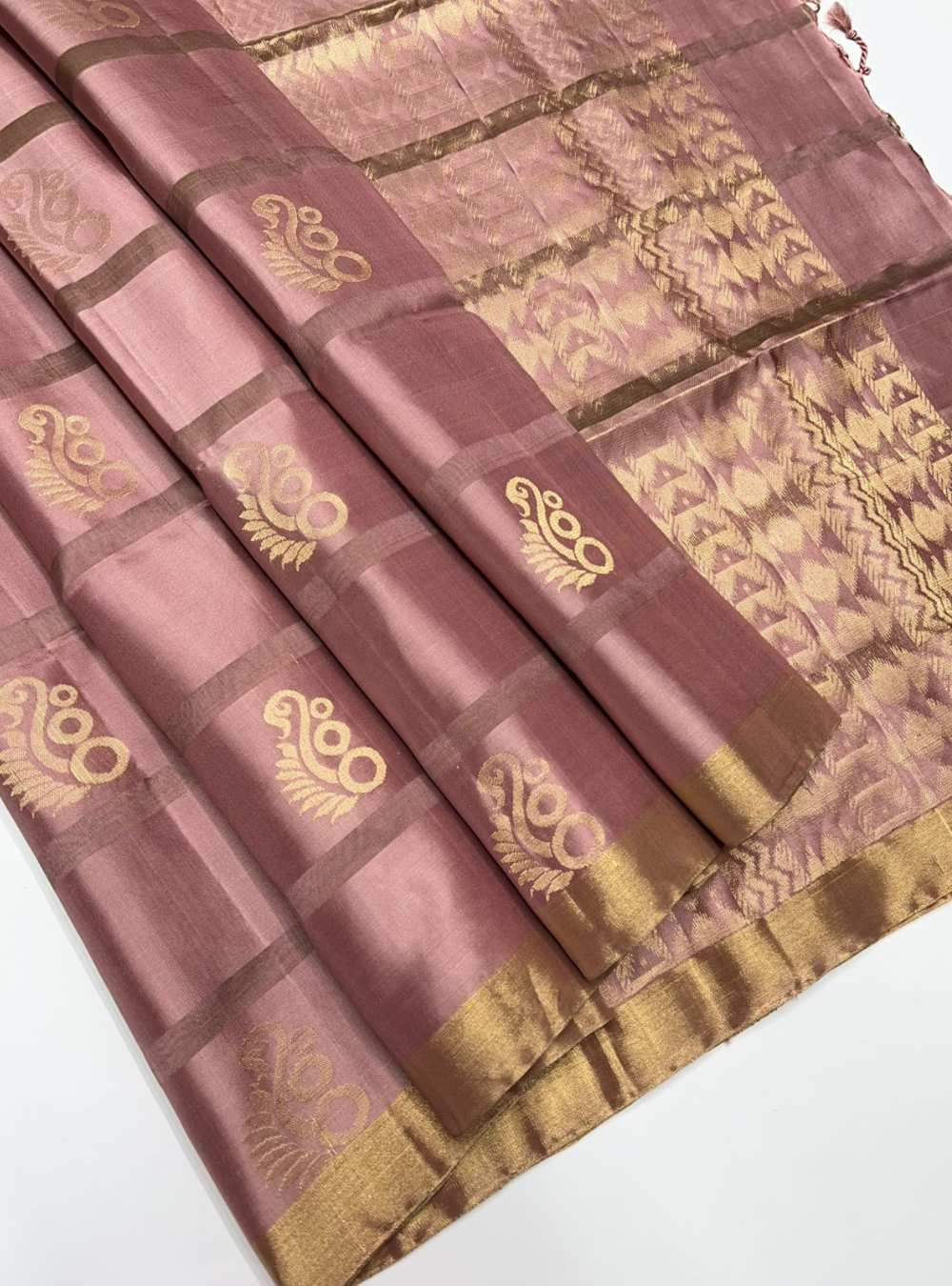 Dusty Peach Soft Silk Saree with fancy jacquard border and gold zari motifs, handwoven mulberry silk, festive wear.