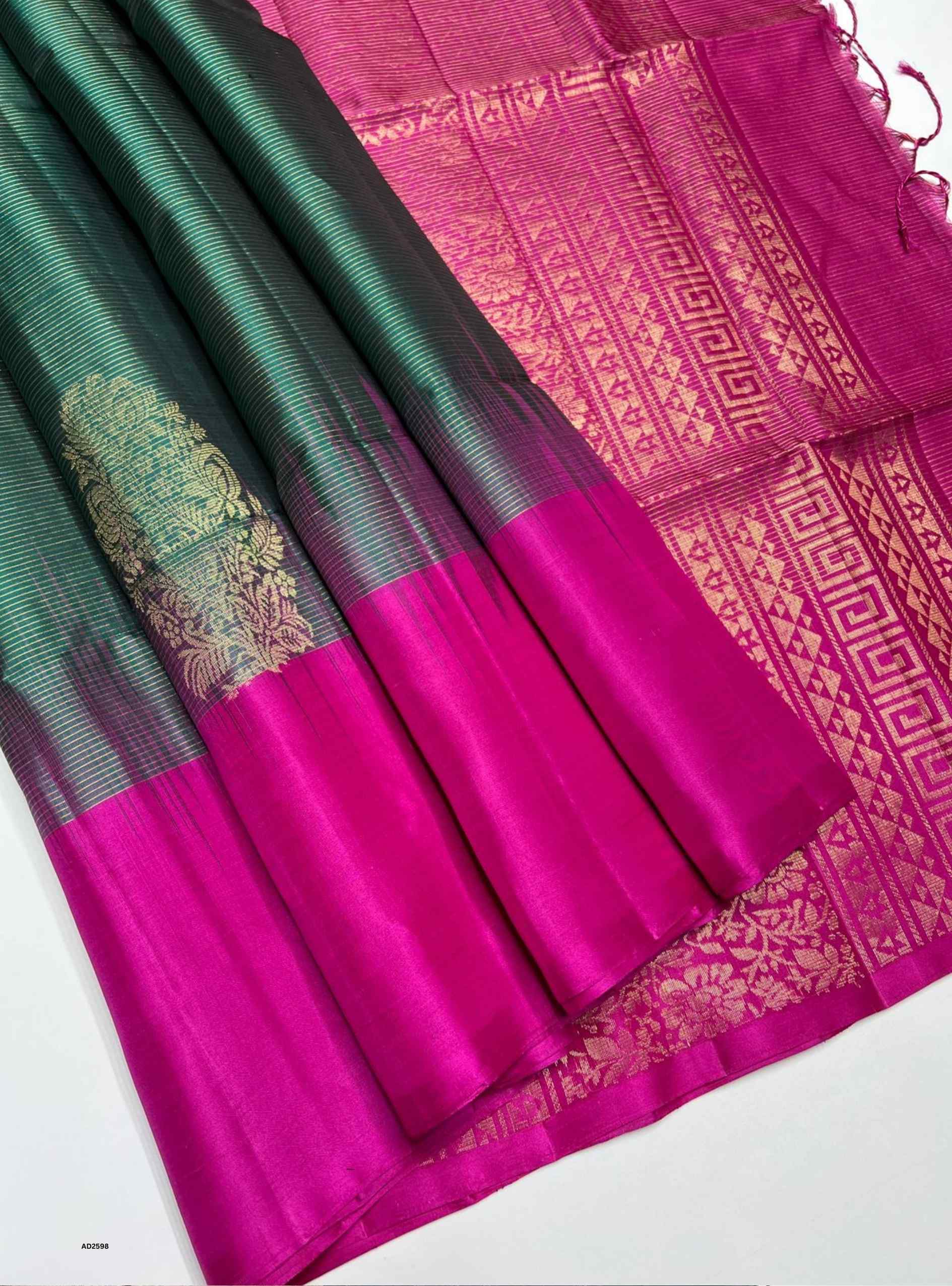 Emerald Green and Pink Bhutta Soft Silk Saree with gold striped border.