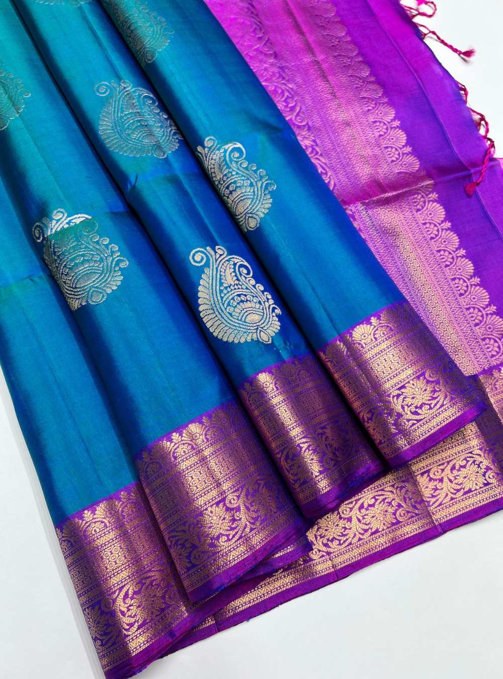 Peacock Blue and Purple Soft Silk Saree with jacquard border and gold zari motifs, handwoven mulberry silk, festive wear.