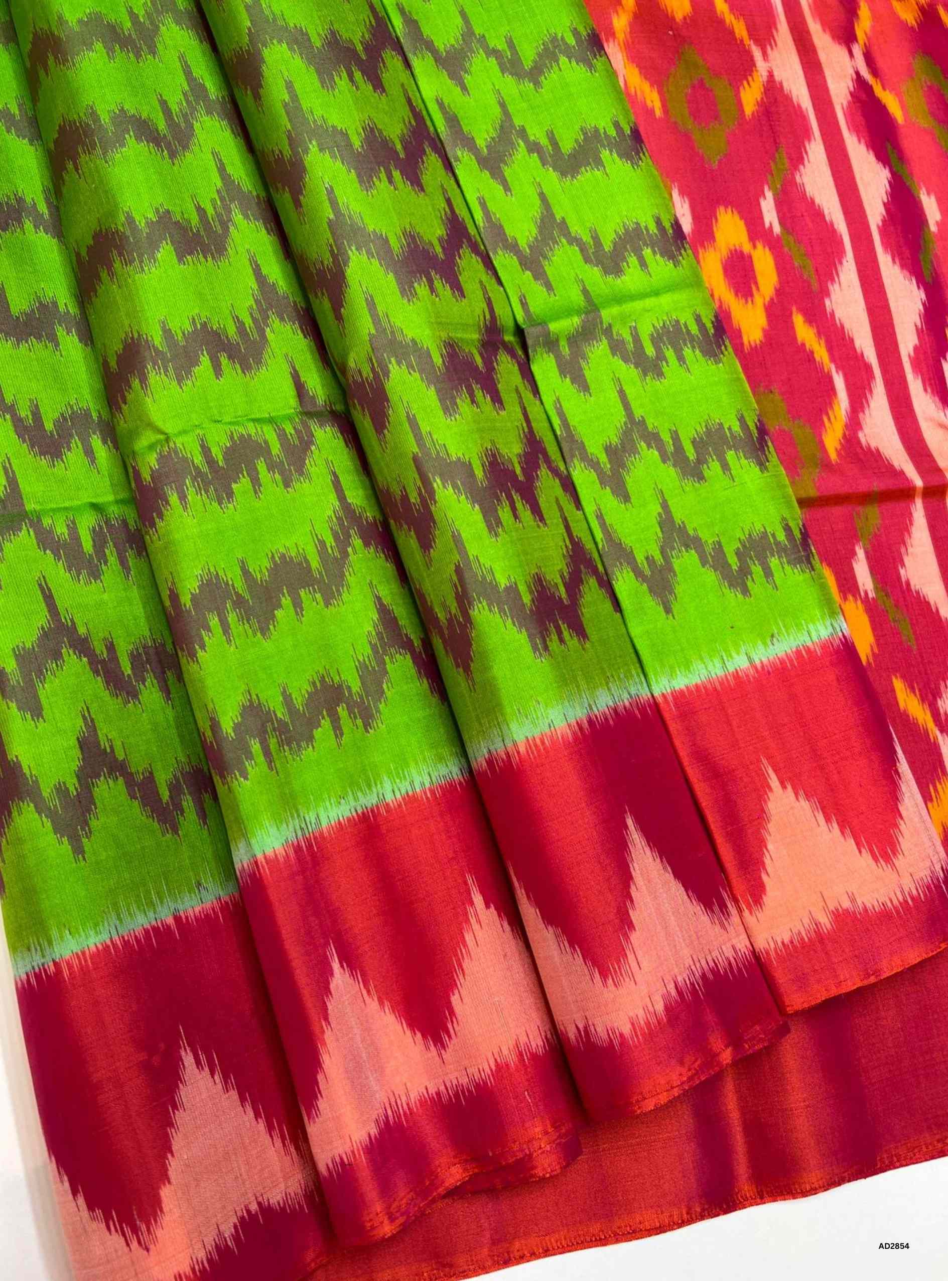 Pochampally Soft Silk Saree in Green body with Orangish Pink pallu, Ikat handwoven design, Half Fine Gold Zari, 6.25m length including blouse.