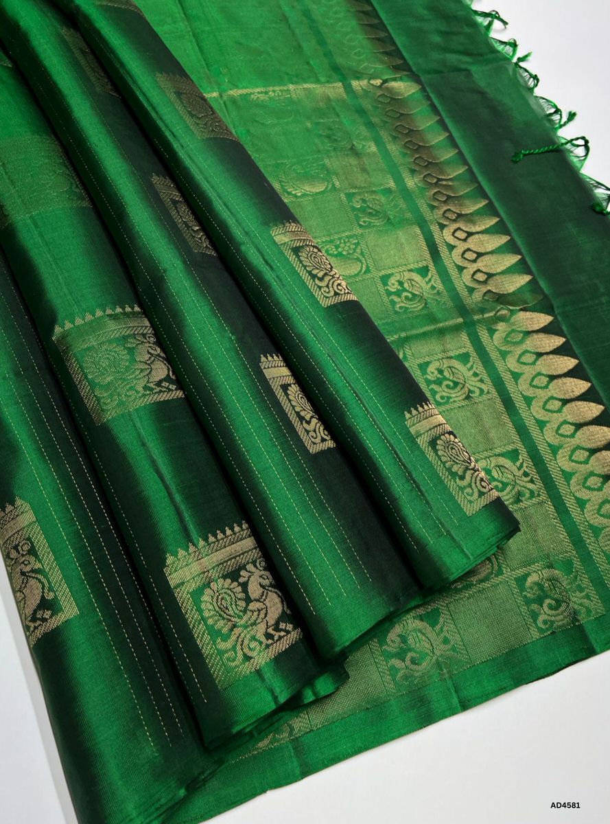 The Green Bhutta Soft Silk Saree with Pure Gold Zari is a radiant handwoven creation that symbolizes prosperity and devotion, enriched with intricate bhutta motifs, making it ideal for weddings, temple ceremonies, and festive occasions.