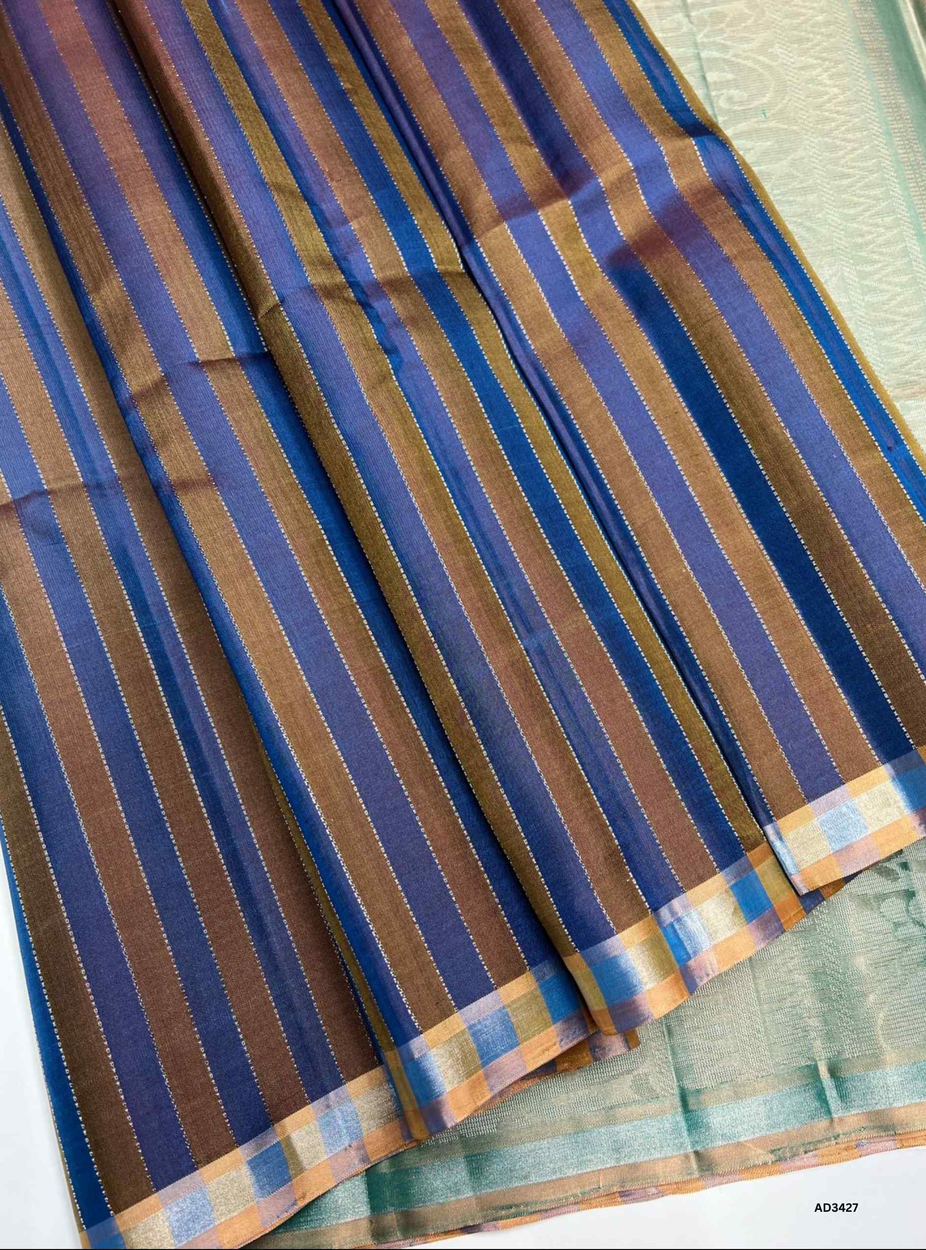 The Blue & Pastel Green Soft Silk Saree is a graceful handwoven creation featuring a plain blue body that exudes simplicity and charm. Its highlight is the pastel green pallu, enriched with zari accents, which adds a refreshing contrast and elevates the drape with elegance. Perfect for festive occasions, weddings, and cultural gatherings, this saree blends minimalism with traditional sophistication.