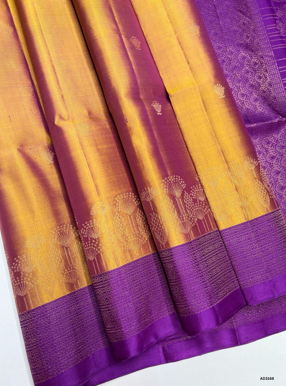 "Handwoven Bronze body with Purple pallu Turning Border Soft Silk Saree featuring gold zari motifs and turning borders"