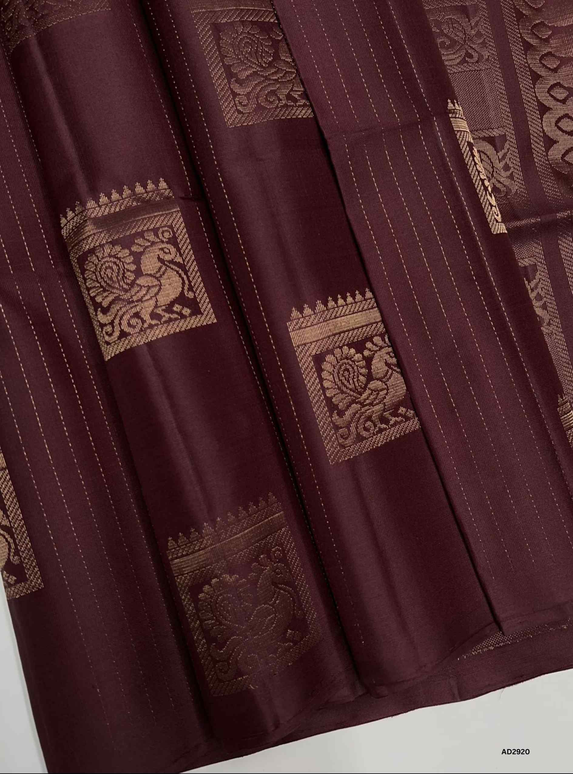 "Handwoven Brown body Bhutta Soft Silk Saree featuring gold zari motifs and elegant border"