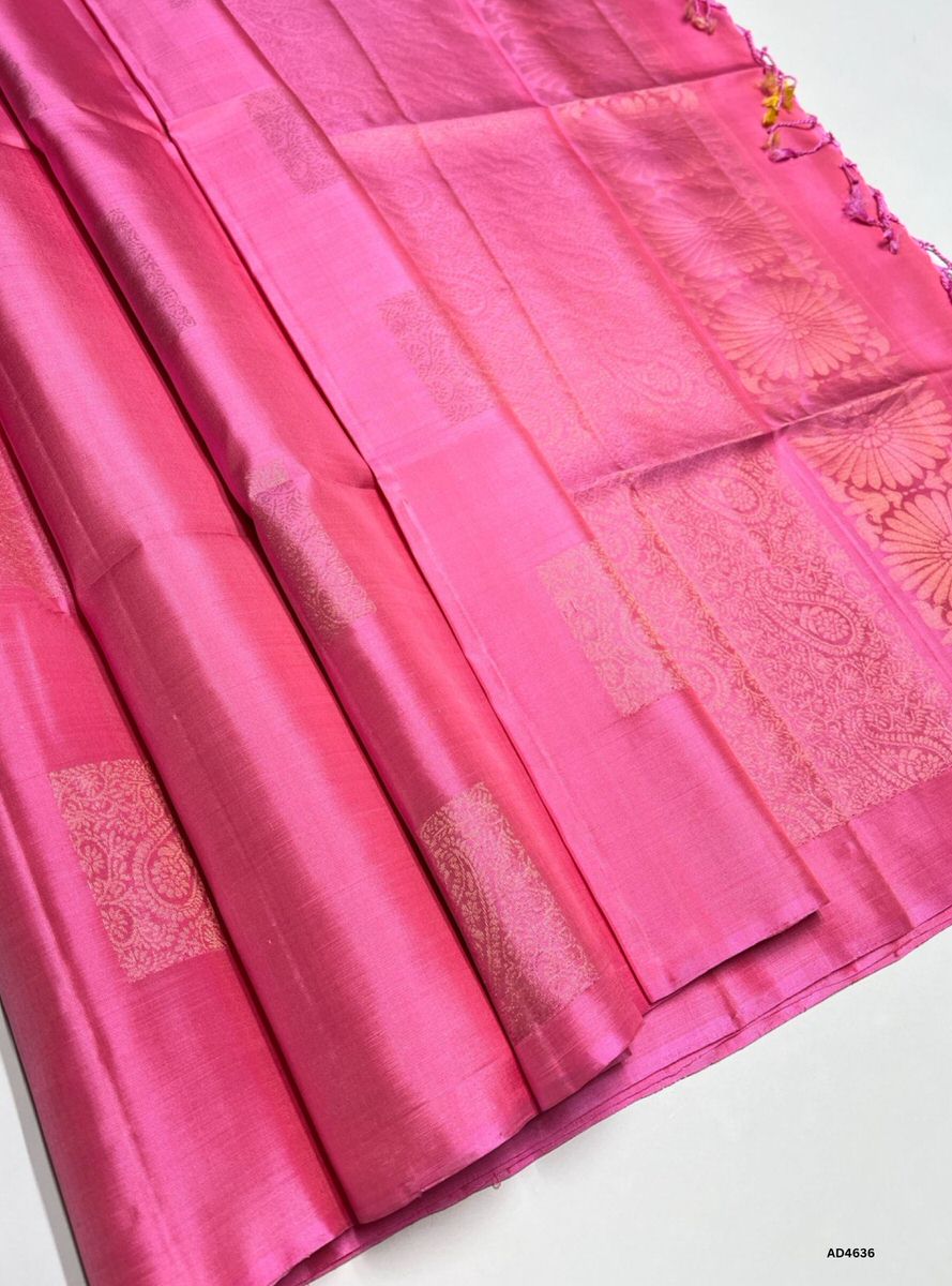 The Bubble Gum Pink Bhutta Soft Silk Saree with Pure Gold Zari is a radiant handwoven creation that embodies youthful charm and cultural richness, making it perfect for weddings, temple ceremonies, and festive occasions.
