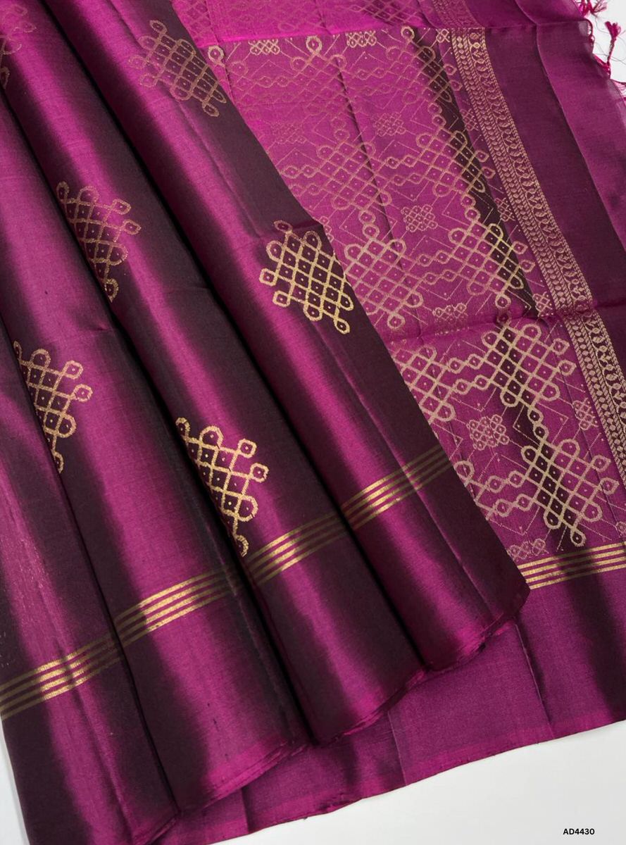 The Burgundy Kolam Soft Silk Saree with Pure Gold Zari is a majestic handwoven creation that radiates devotion, elegance, and cultural artistry, making it perfect for weddings, temple ceremonies, and festive occasions.