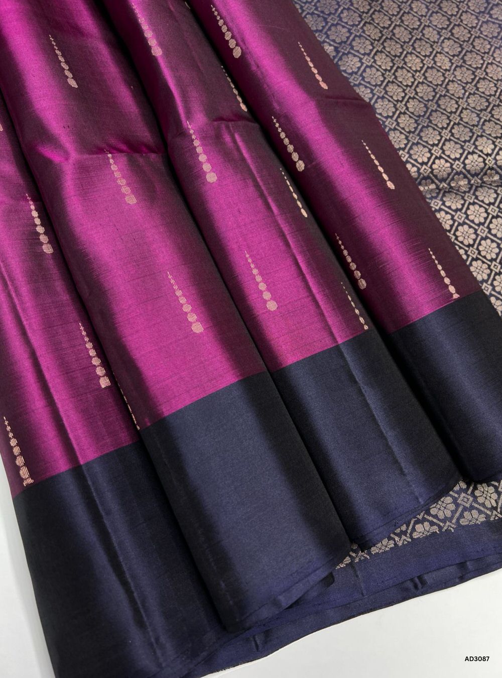 "Handwoven Dark Berry body with Blue pallu Bhutta Soft Silk Saree featuring gold zari motifs and borders"