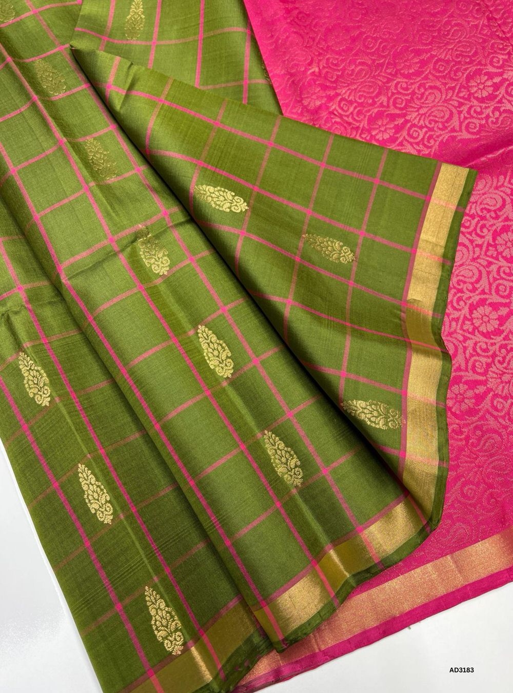 "Handwoven Dark Green body with Pink pallu Checkered Bhutta Soft Silk Saree featuring gold zari motifs and borders"