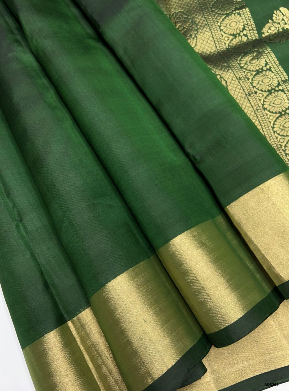"Handwoven Dark Green body with rich zari pallu Plain Soft Silk Saree featuring gold border"