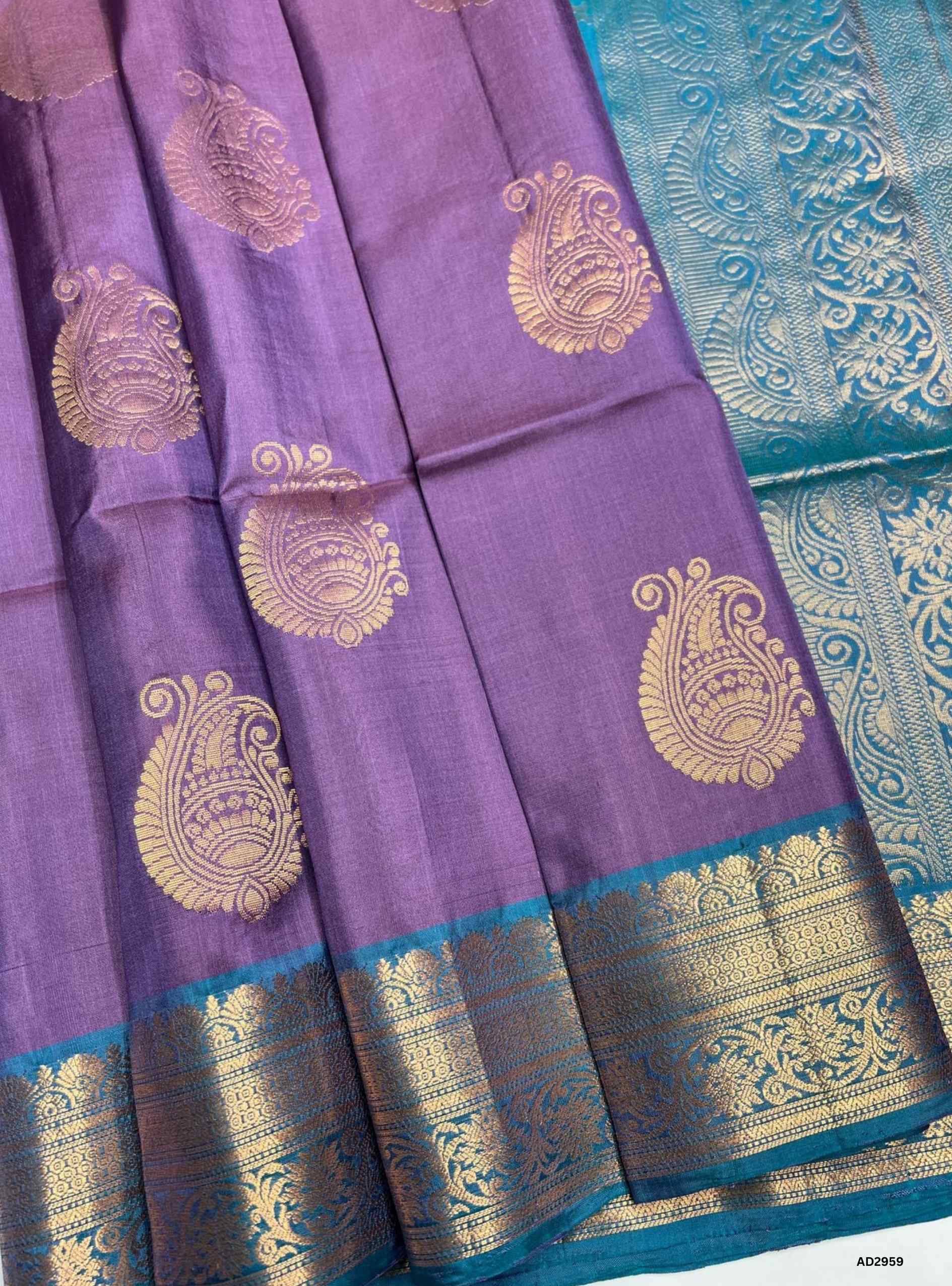 "Handwoven Dark Lavender body with Rama Green pallu Bhutta Jacquard Border Soft Silk Saree featuring gold zari motifs"