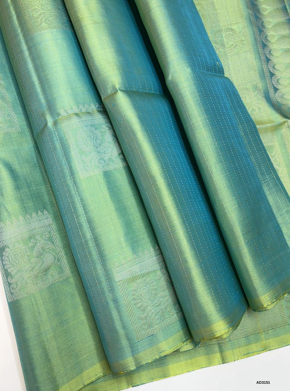 "Handwoven Dual Tone Green Bhutta Soft Silk Saree featuring gold zari motifs and borders"