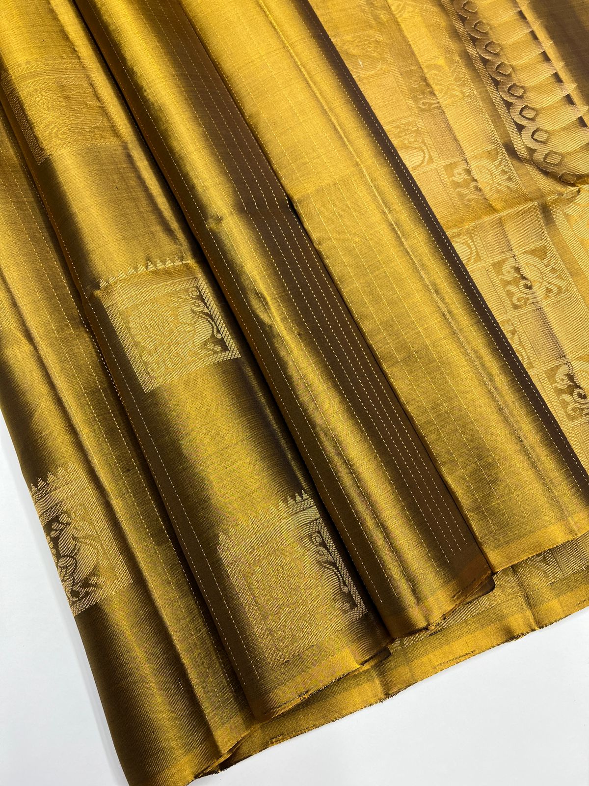 Gold fabric with intricate patterns 