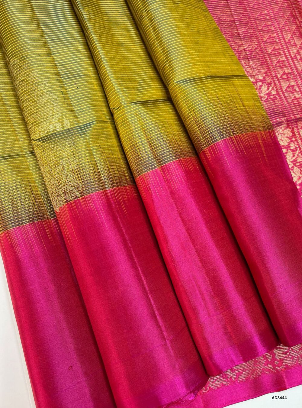 "Handwoven Golden Green body with Orangish Pink contrast border Striped Bhutta Soft Silk Saree featuring gold zari motifs"