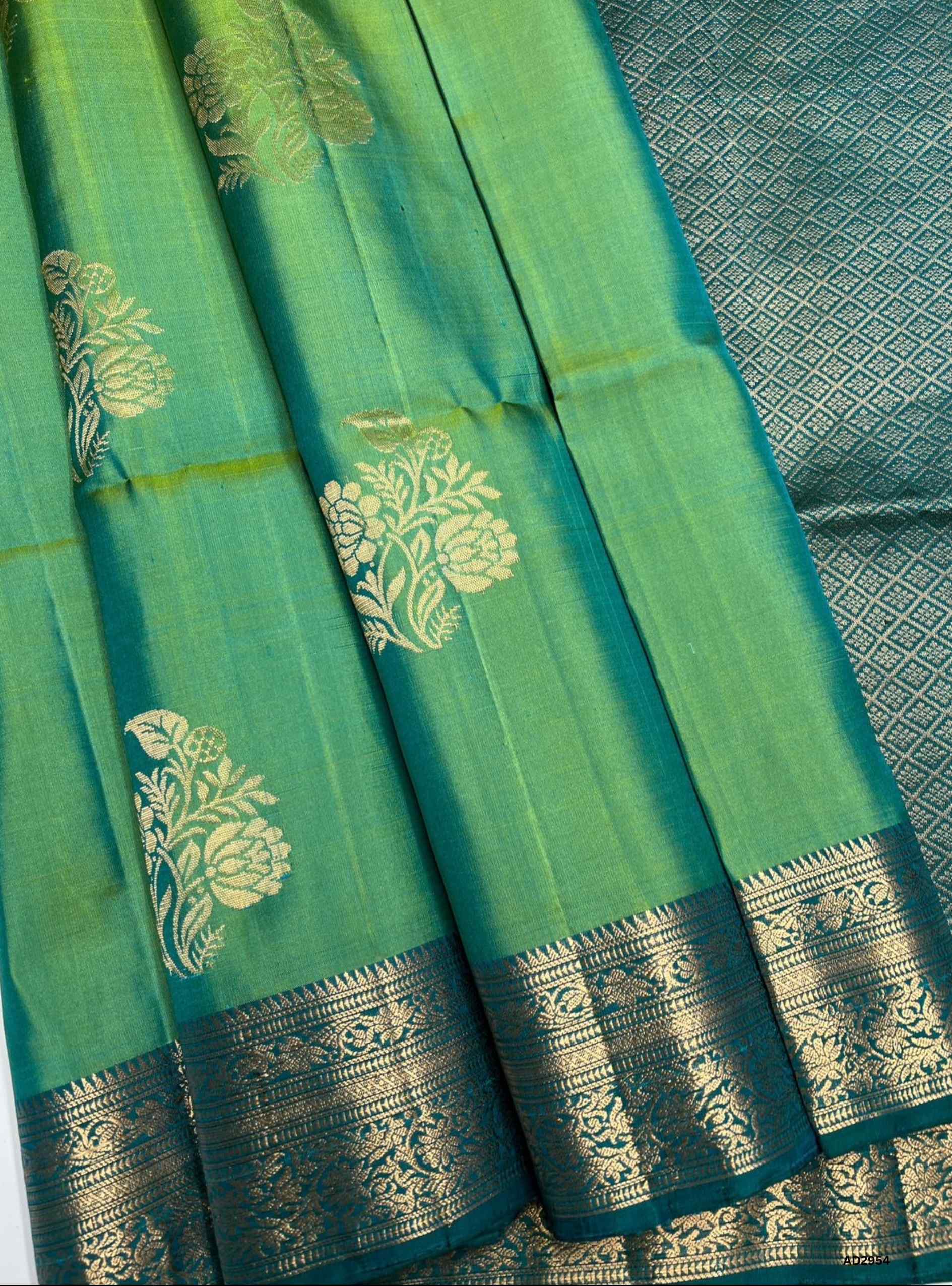 "Handwoven Green Bhutta Jacquard Border Soft Silk Saree featuring gold zari motifs"