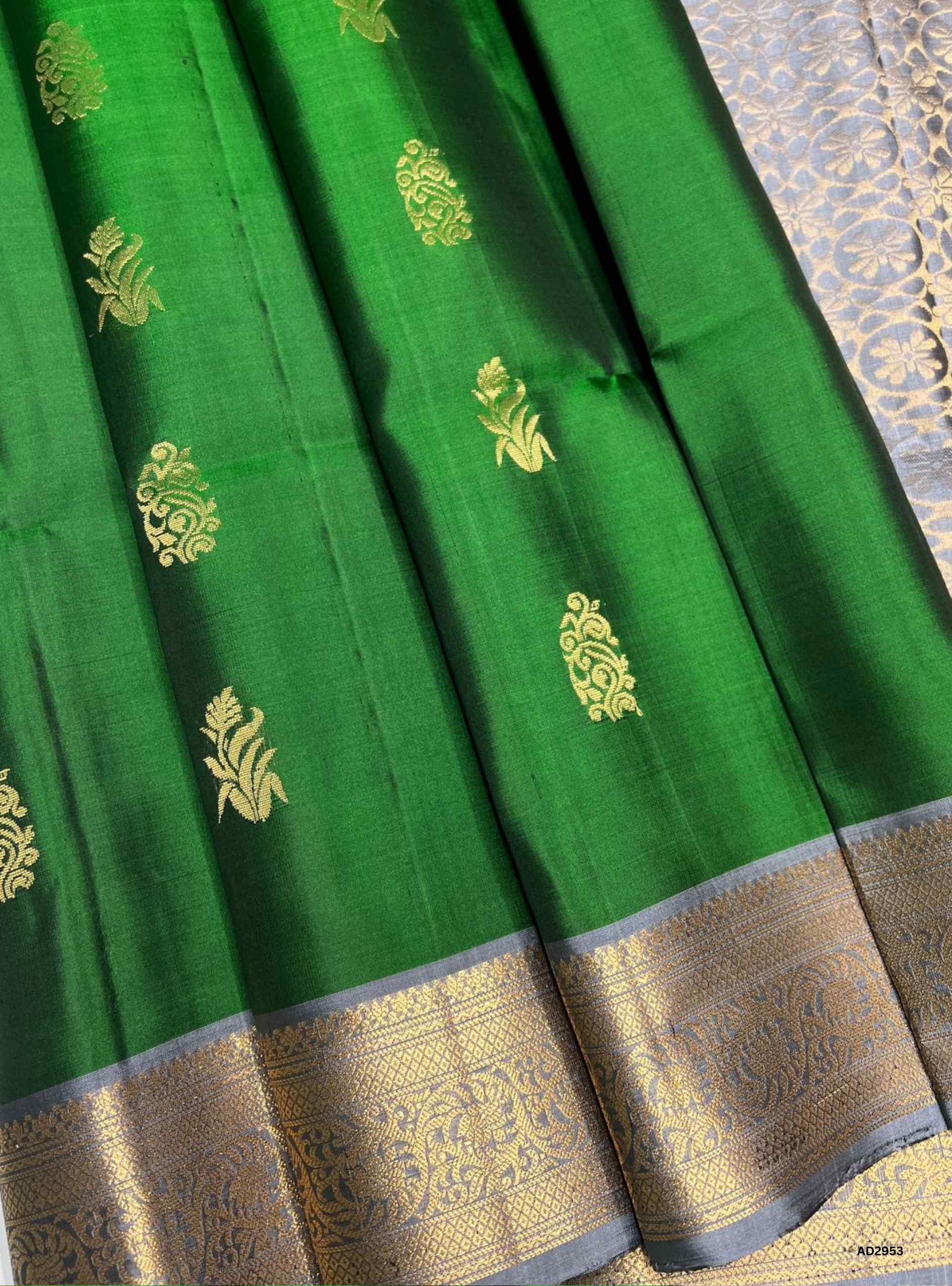 Handwoven Green body with Bluish Grey pallu Bhutta Jacquard Border Soft Silk Saree featuring gold zari motifs"