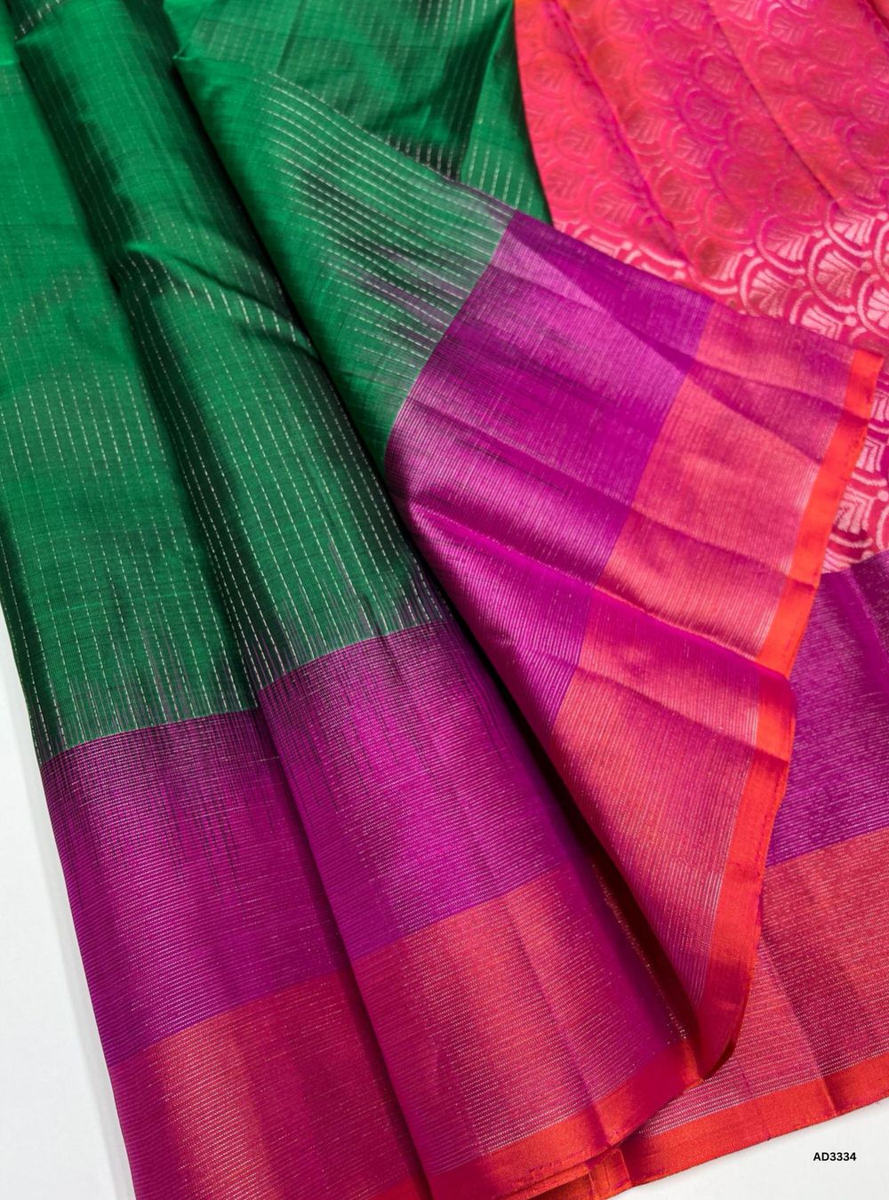 "Handwoven Green body with Pink and Orangish Pink checks Checkered Soft Silk Saree featuring gold zari motifs and borders"