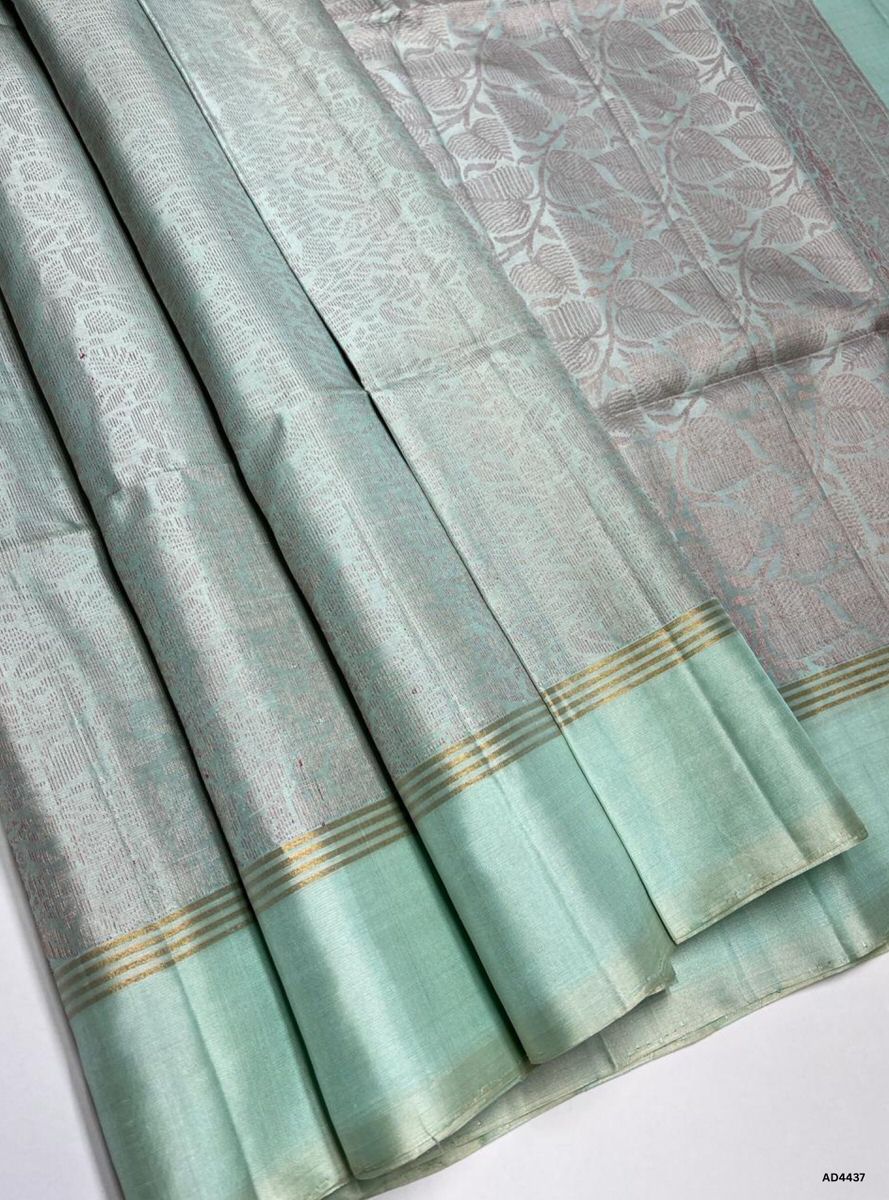 The Light Turquoise Blue Soft Silk Bridal Saree with Half Fine Tested Gold Zari is a graceful handwoven creation that radiates serene elegance and festive charm, making it ideal for weddings, receptions, and auspicious occasions.