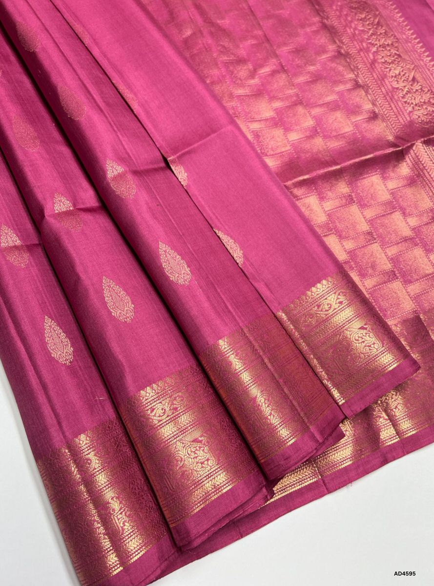 The Mulberry Kanchi Border Soft Silk Saree with Pure Gold Zari is a luxurious handwoven creation that radiates regal charm and cultural richness, making it ideal for weddings, temple ceremonies, and festive occasions.