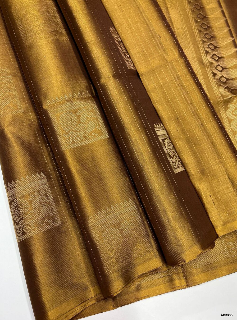 Handwoven Olive Brown body Bhutta Soft Silk Saree featuring gold zari motifs and borders"