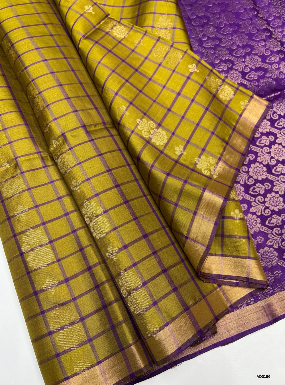"Handwoven Olive Green body with Purple pallu Checkered Bhutta Soft Silk Saree featuring gold zari motifs and borders"