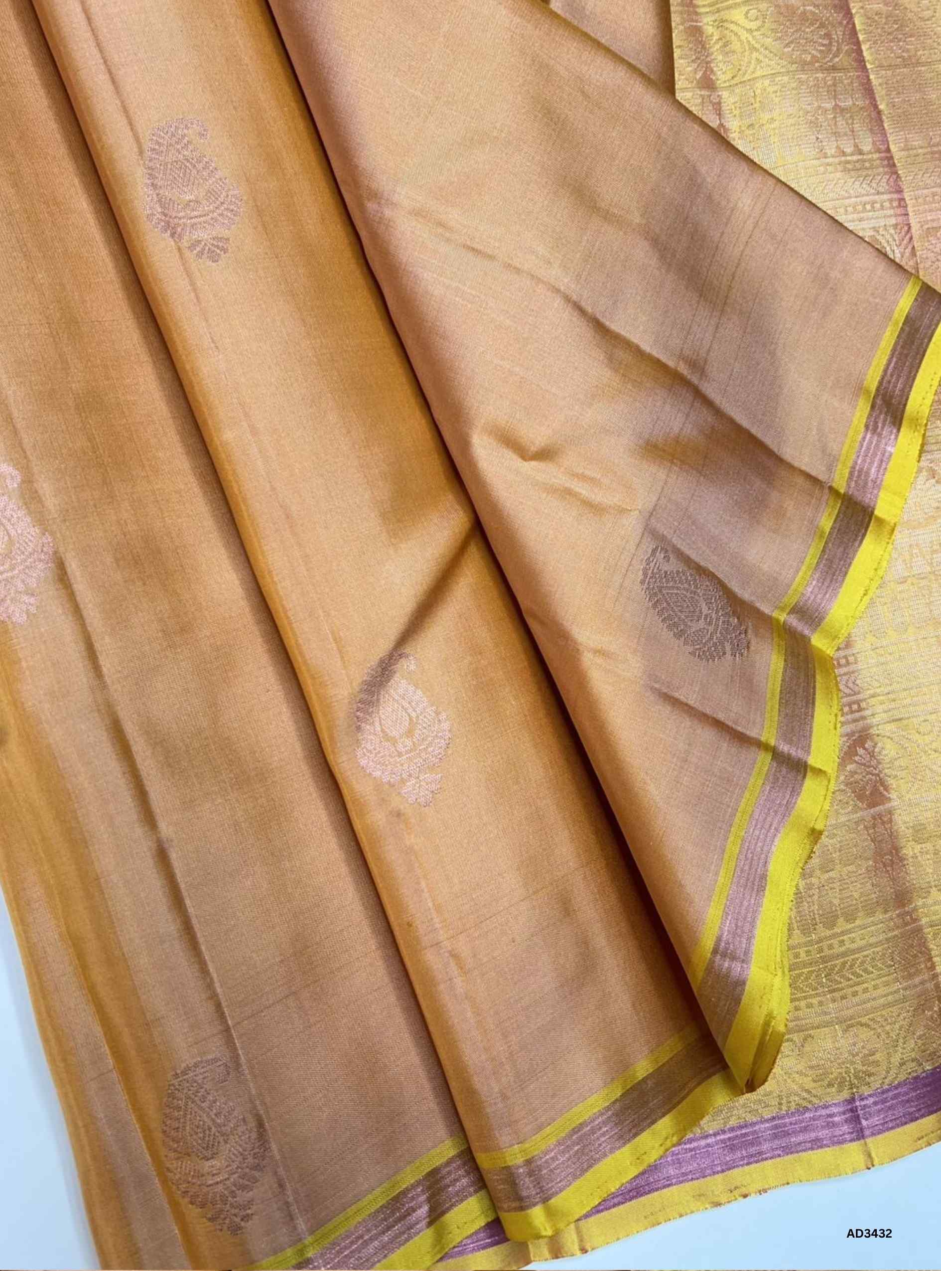 Handwoven Peach body with Yellow pallu Bhutta Soft Silk Saree featuring gold zari motifs and borders