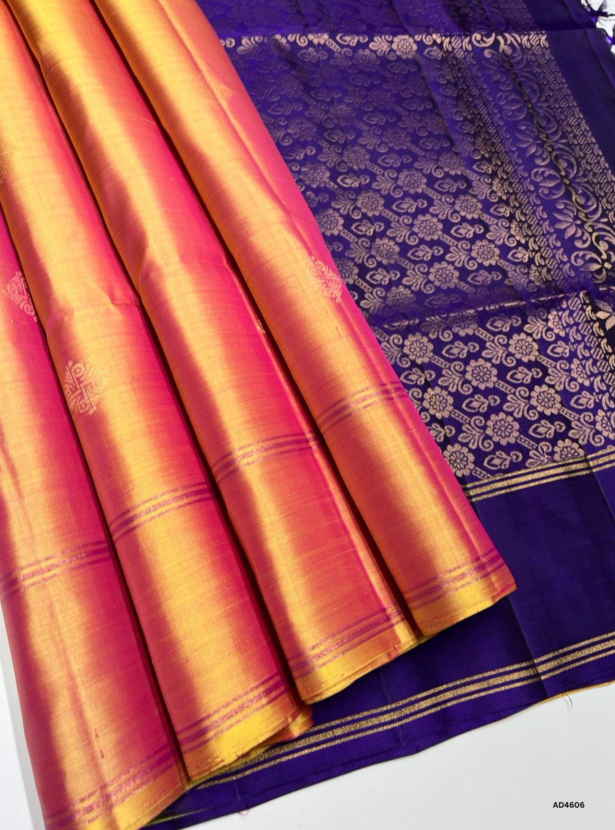 The Peachish & Purple Bhutta Soft Silk Saree with Pure Gold Zari is a festive handwoven creation that unites pastel charm with regal depth, enriched by intricate bhutta motifs, making it ideal for weddings, temple ceremonies, and cultural occasions.