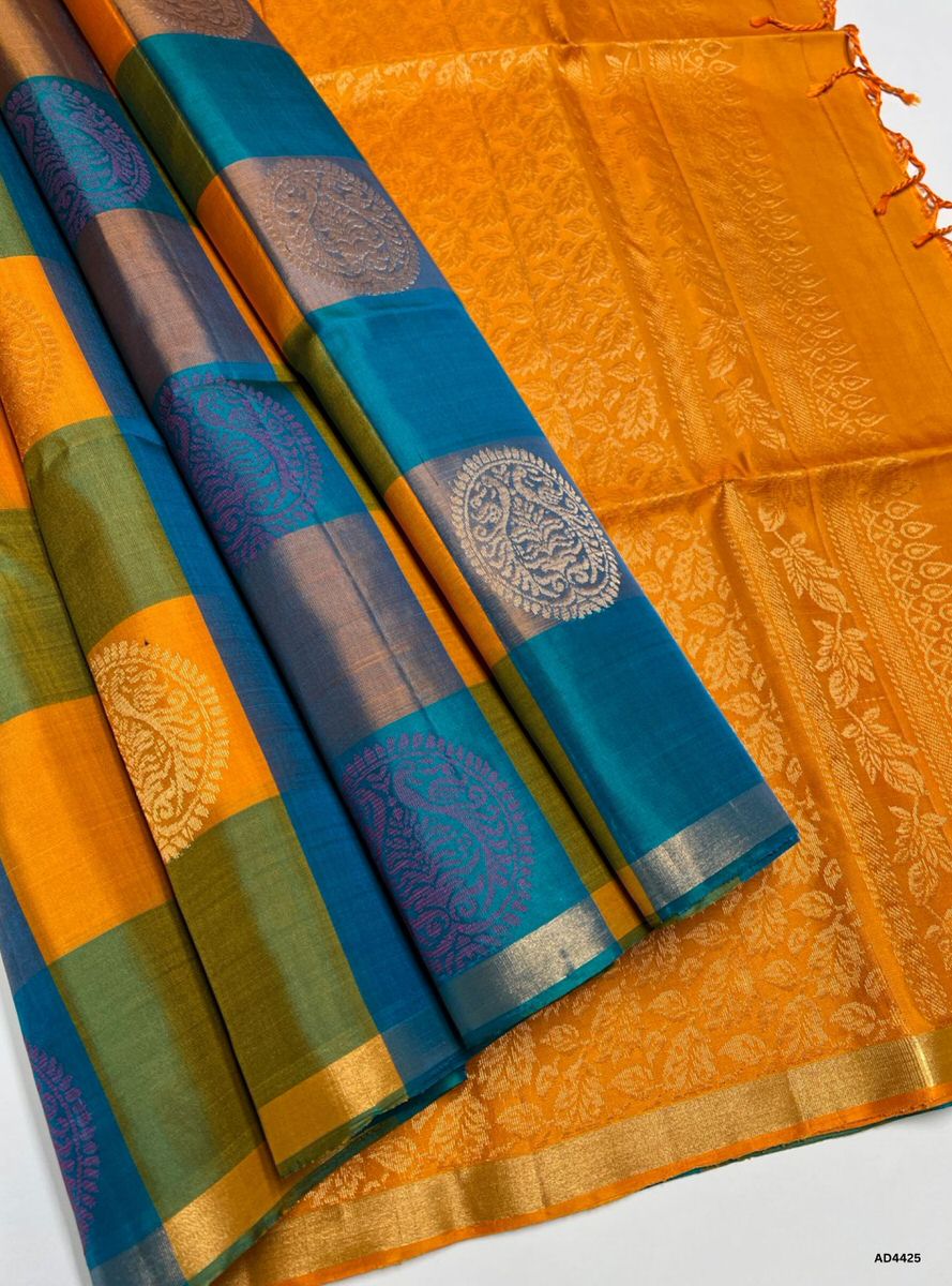 The Peacock Blue & Mango Yellow Pazhum Pazhamum Soft Silk Saree with Half Fine Tested Gold Zari is a radiant handwoven creation that unites jewel‑tone vibrance with festive warmth, making it ideal for weddings, temple ceremonies, and cultural celebrations.
